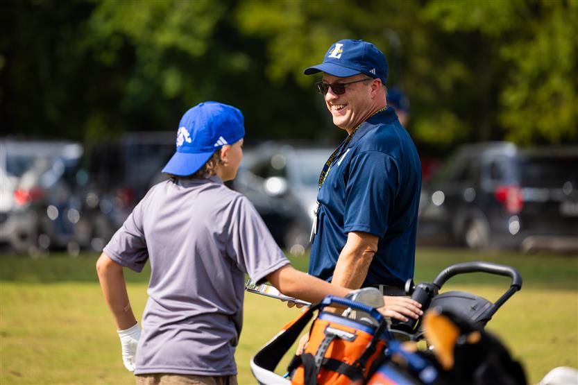 Students play golf